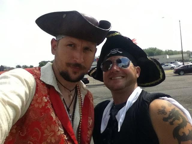Woody's Pirate Party — two men in pirate hats selfie in parking lot outside the venue