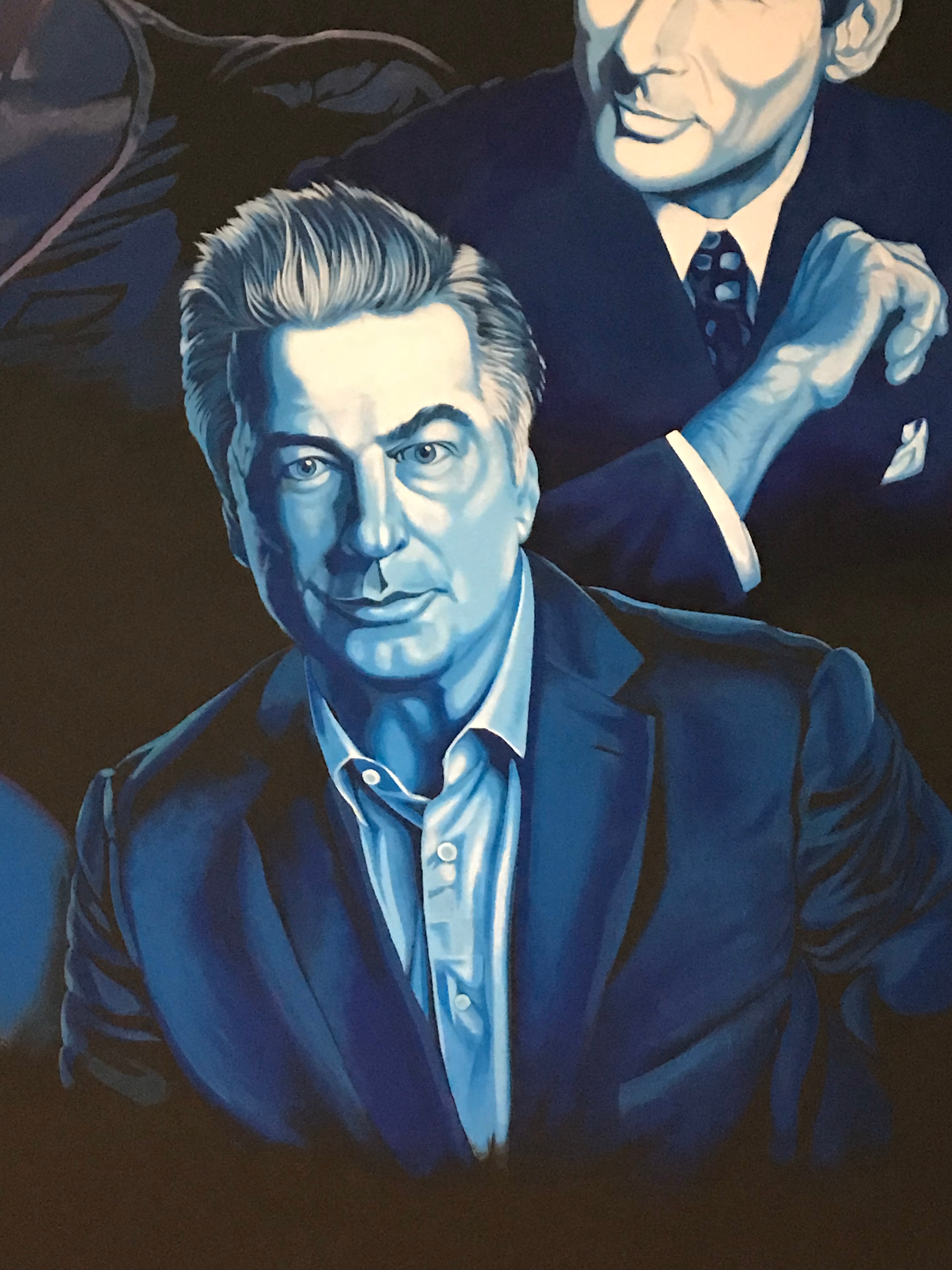 Club 11 mural detail — Alec Baldwin portrait in cool blue tones with Richard Gere visible above