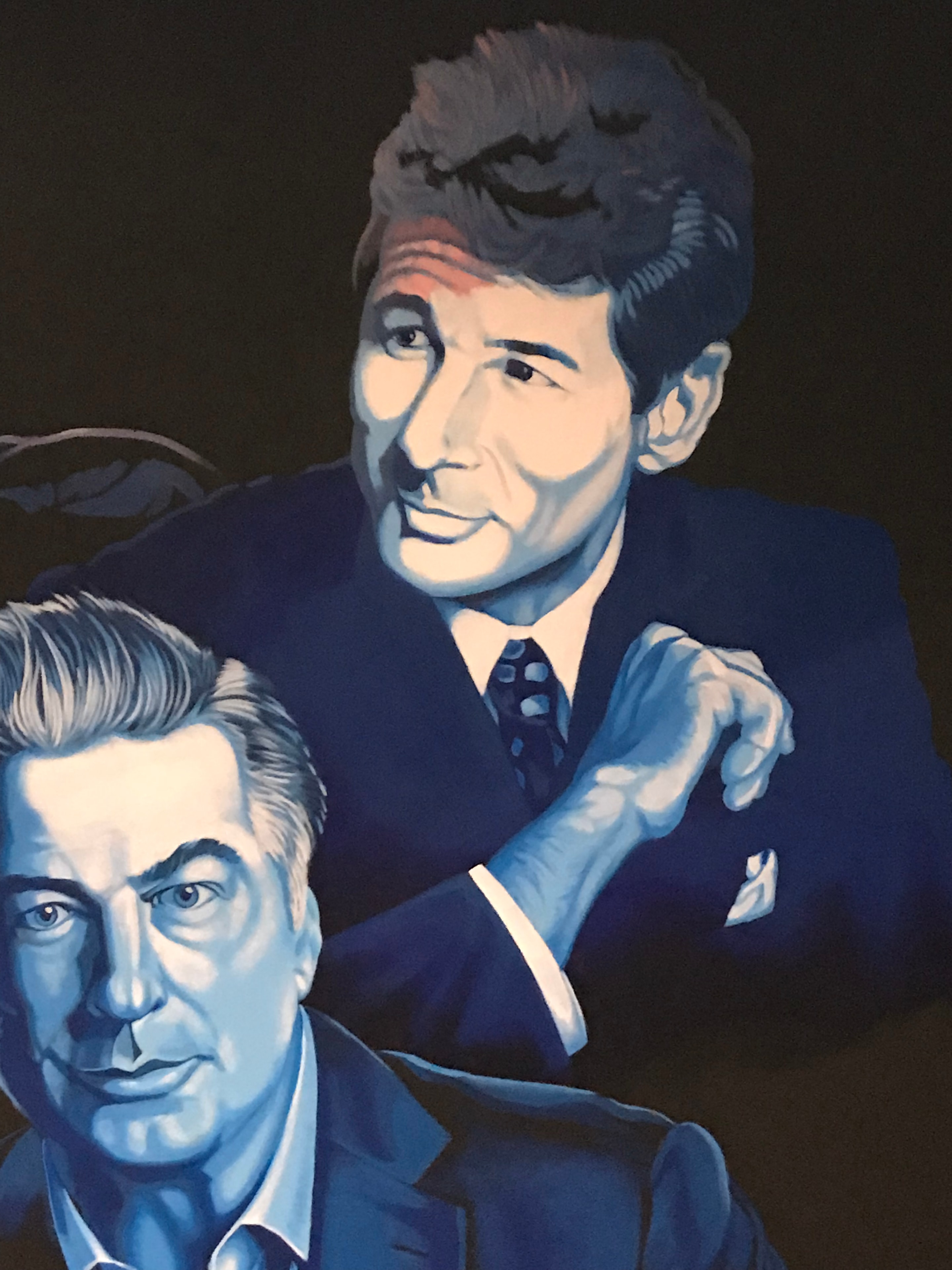 Club 11 mural detail — Richard Gere and Alec Baldwin portrait close-up in blue and dark tones