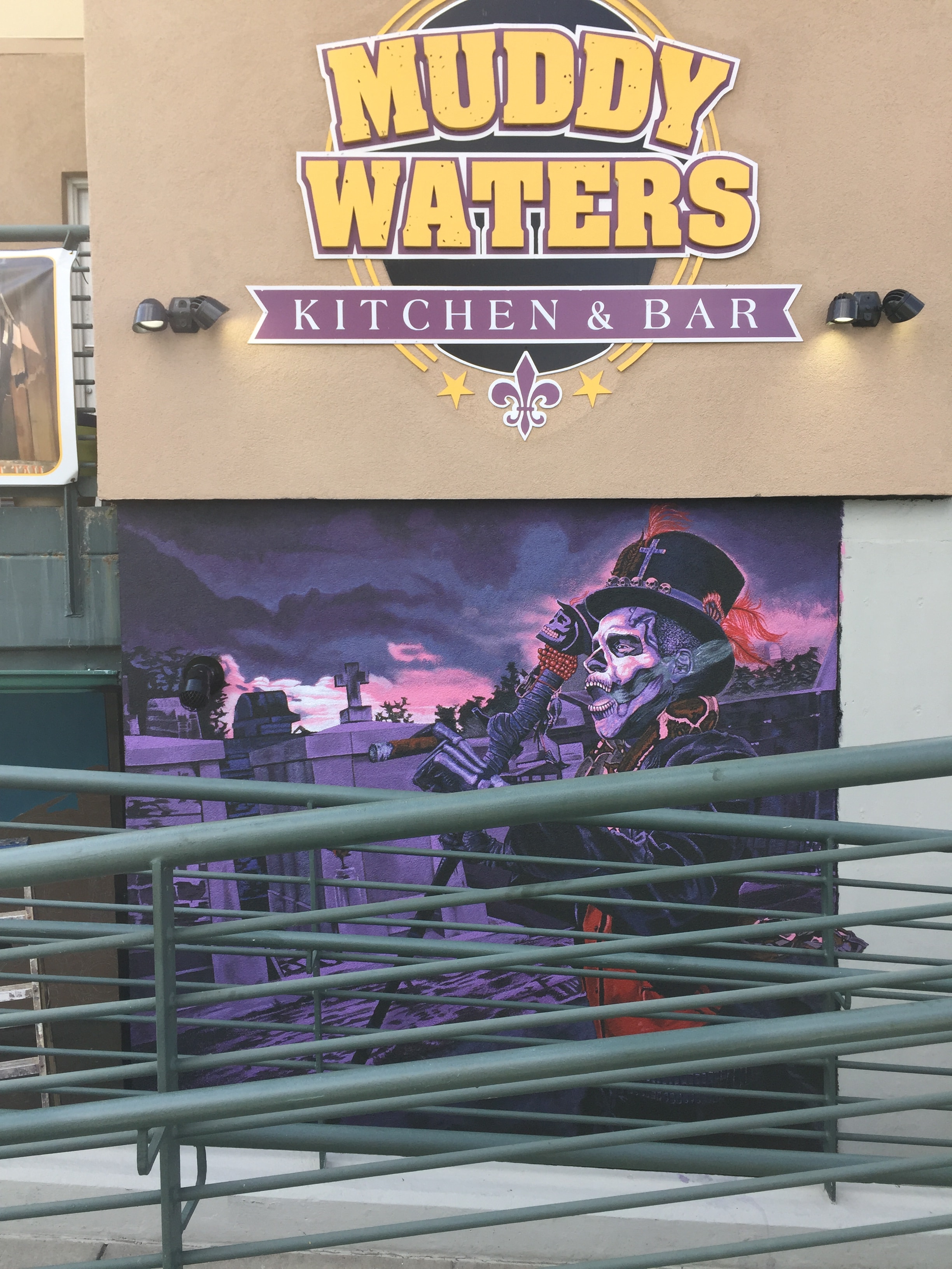 Muddy Waters exterior sign with voodoo mural
