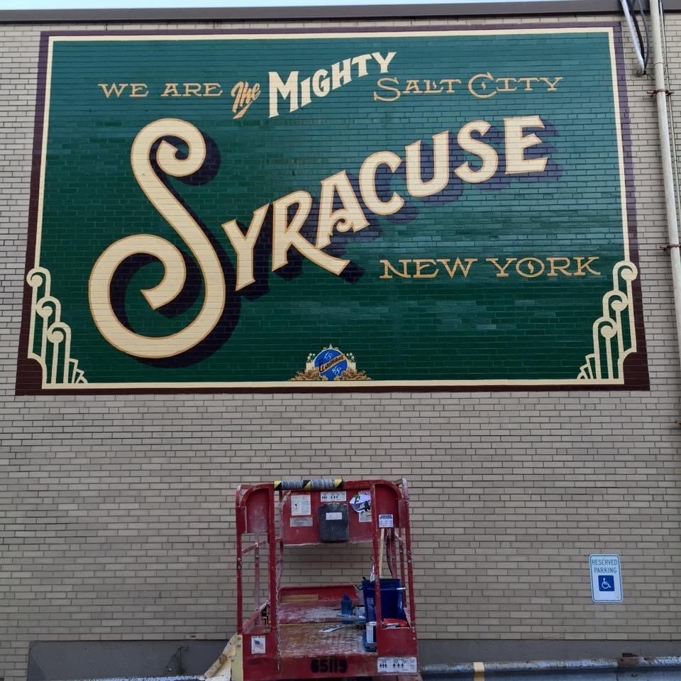 Final completed mural — full view in natural daylight, all elements finished