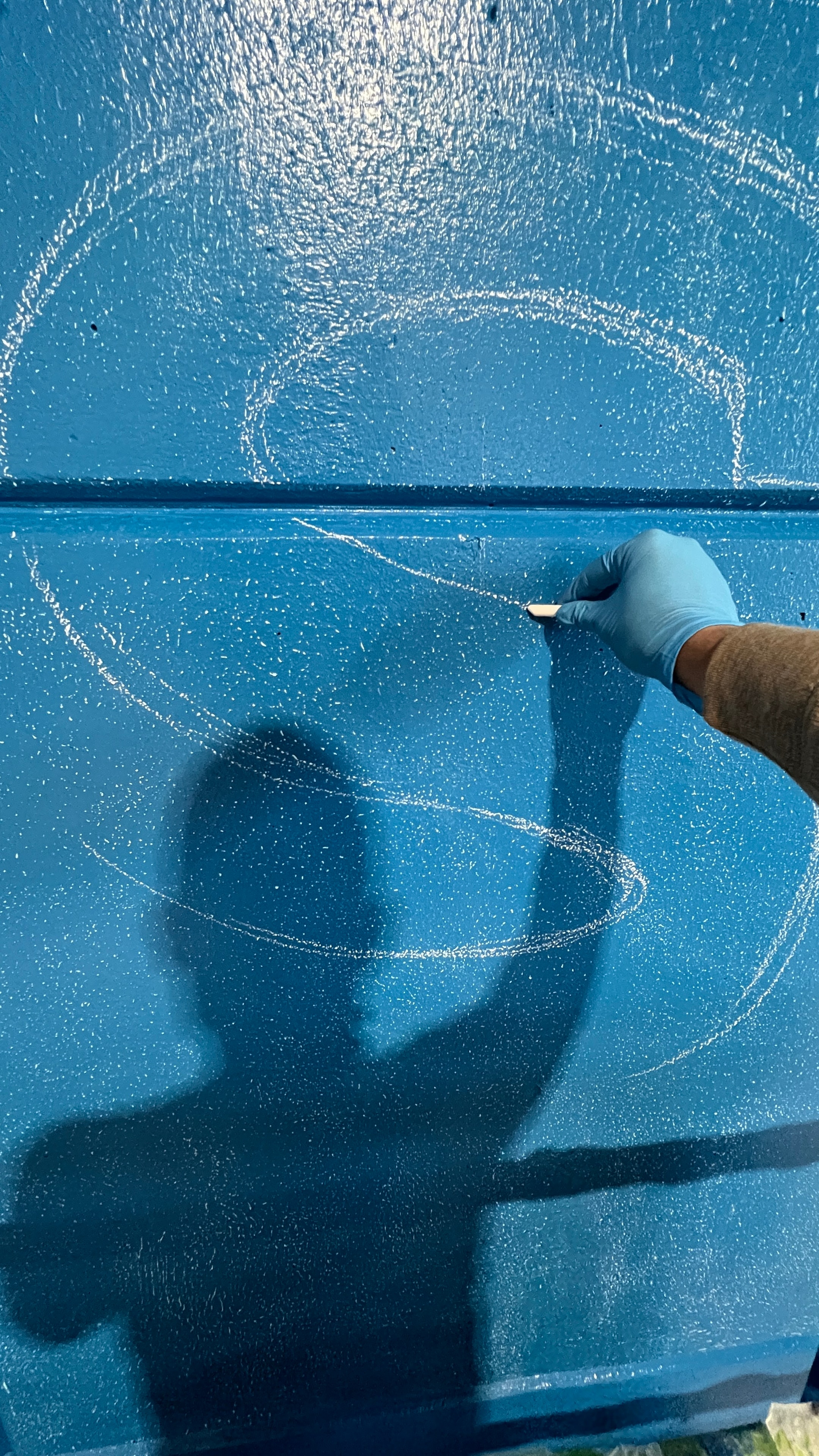 Full chalk layout of the splash graphics across the lower wall panels