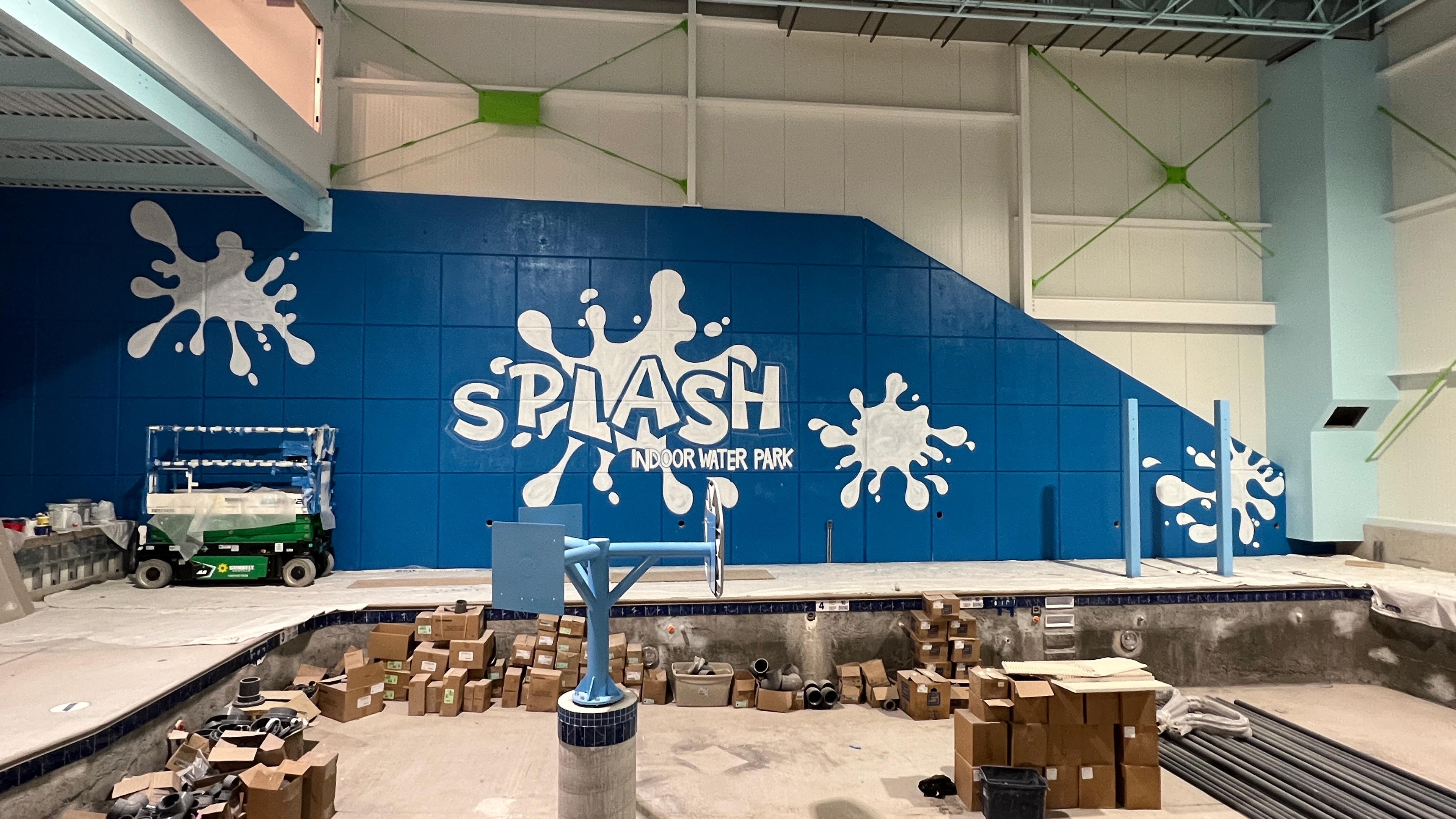 White base coat applied — SPLASH lettering and splash blobs blocked in, viewed from above