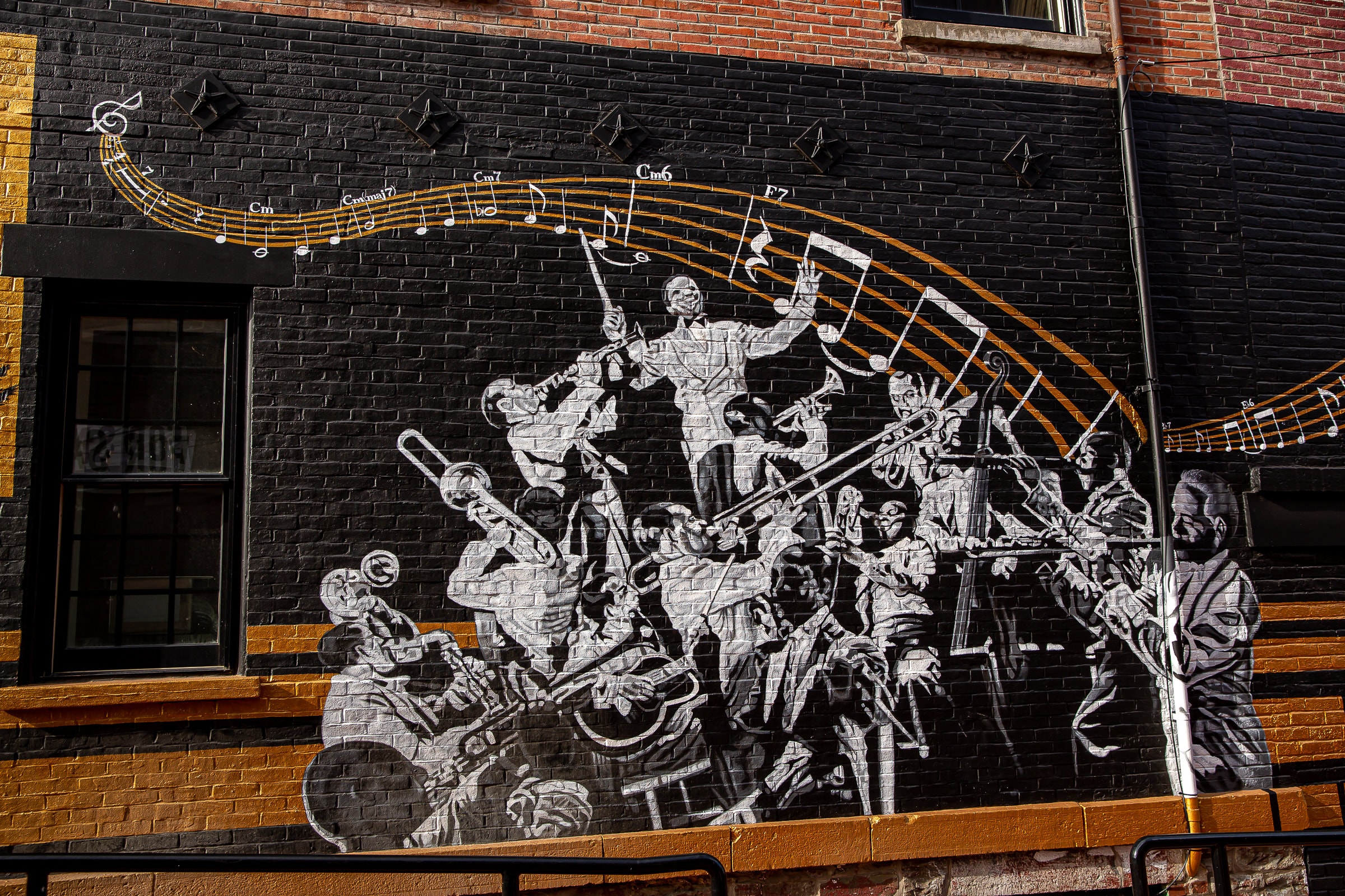 Jazz orchestra with musical notation arc